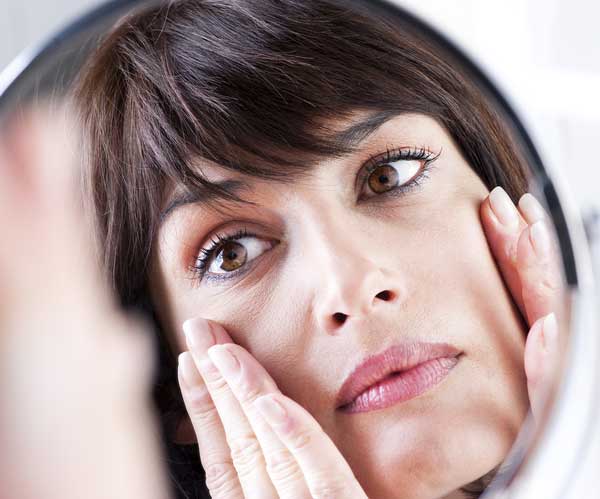 Woman Looking in Mirror