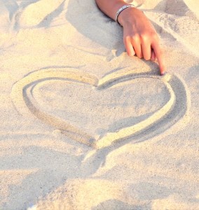 bigstock-Heart-Symbol-Drawn-In-The-Sand-48217328
